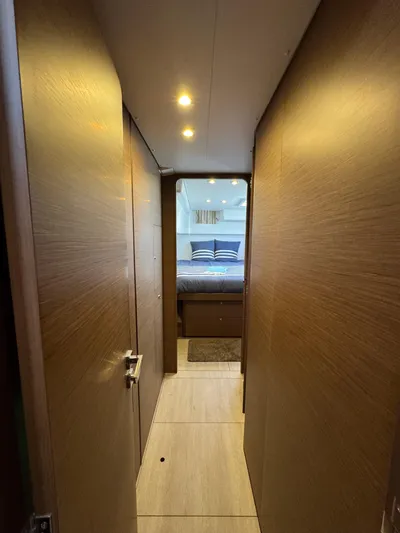 La Vigie Yacht Photos Pics Hallway leading to a cozy bedroom in a 2018 Lagoon 450 F yacht.