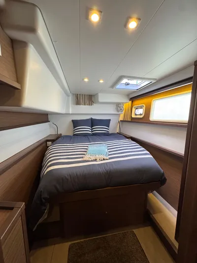 La Vigie Yacht Photos Pics Luxurious cabin interior of 2018 Lagoon 450 F yacht with cozy bedding.