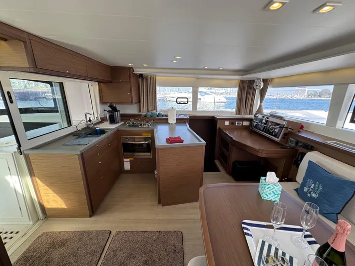 La Vigie Yacht Photos Pics Interior of 2018 Lagoon 450 F catamaran with modern kitchen and dining area.