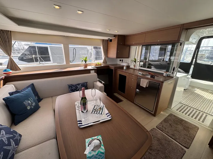 La Vigie Yacht Photos Pics Interior of 2018 Lagoon 450 F catamaran with modern kitchen and cozy seating area.