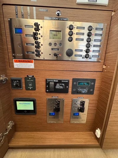 La Vigie Yacht Photos Pics Control panel of a 2018 Lagoon 450 F yacht with various switches and displays.
