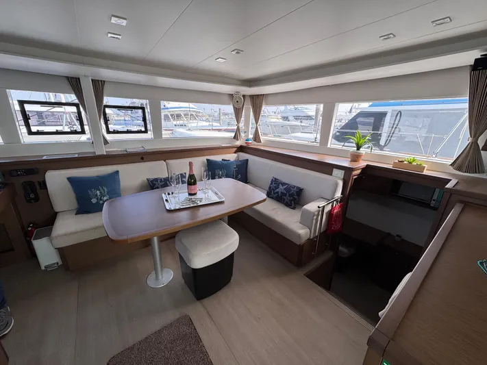 La Vigie Yacht Photos Pics Interior of 2018 Lagoon 450 F catamaran with cozy seating and dining area.