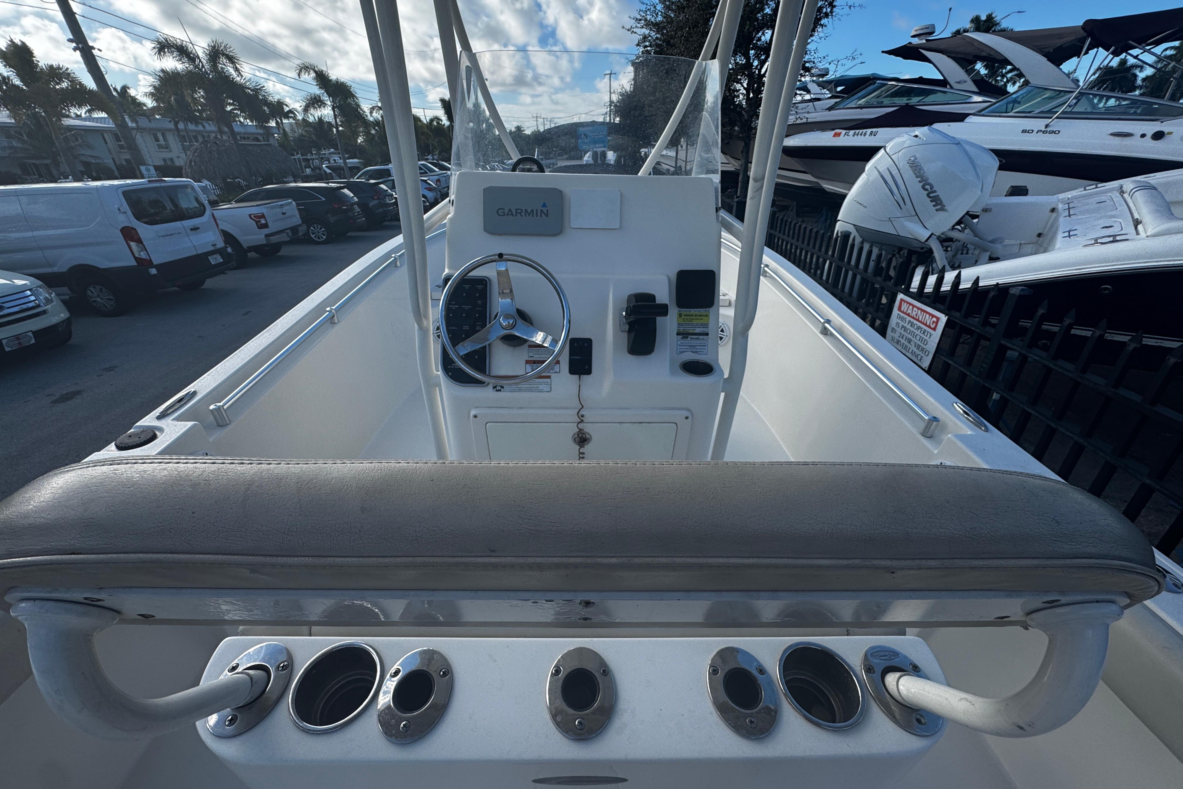 2021 Cobia 220 Center Console boat interior with steering wheel and controls.