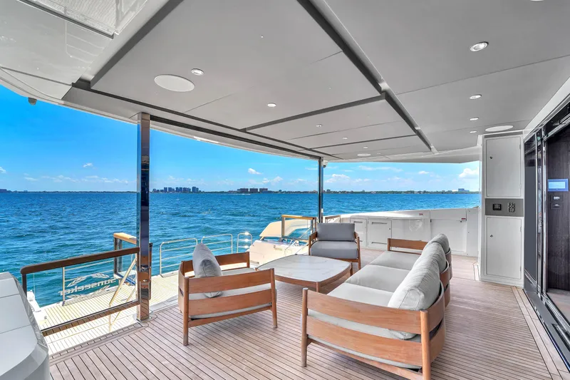 Worth The Wait Yacht Photos Pics Luxurious Sunseeker Ocean 182 yacht deck with modern seating, overlooking serene ocean view.