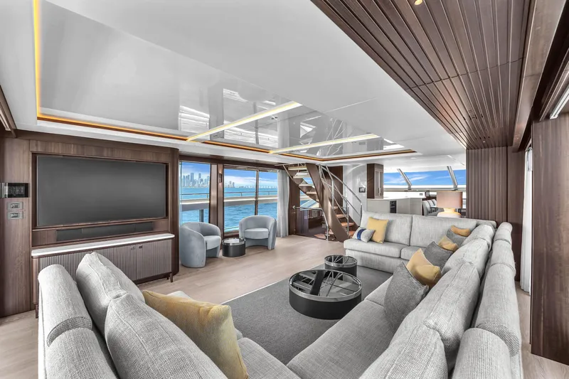 Worth The Wait Yacht Photos Pics Luxurious interior of 2024 Sunseeker Ocean 182 yacht with modern furnishings and ocean view.