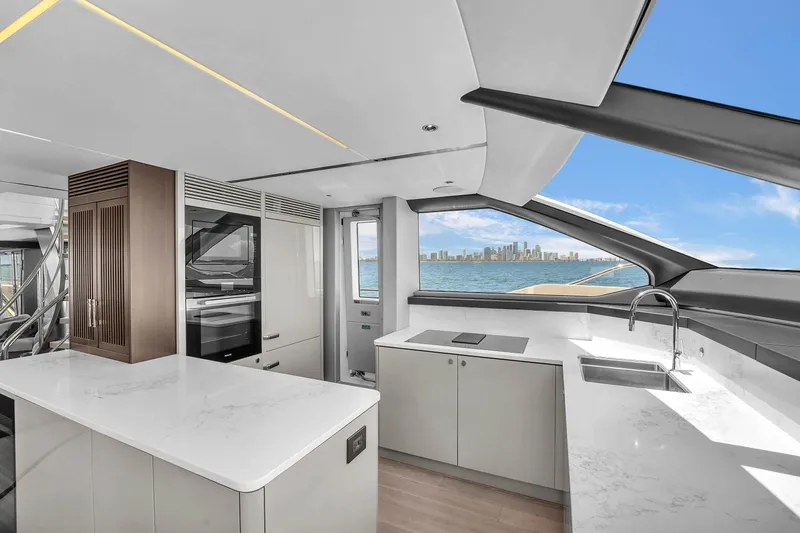 Worth The Wait Yacht Photos Pics Luxurious kitchen interior of 2024 Sunseeker Ocean 182 yacht with ocean view.