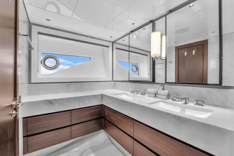 Worth The Wait Yacht Photos Pics Luxurious bathroom in 2024 Sunseeker Ocean 182 yacht with modern fixtures and ocean view.