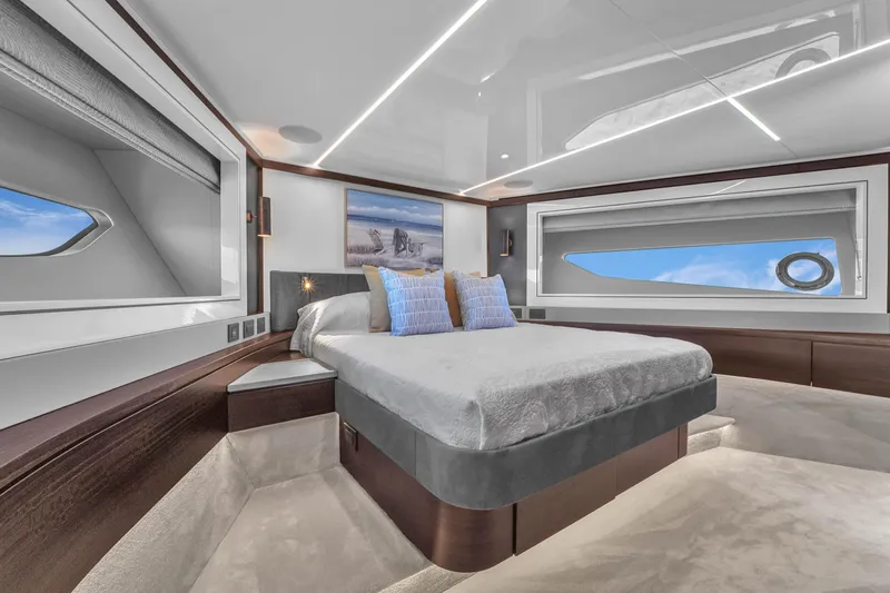 Worth The Wait Yacht Photos Pics Luxurious bedroom interior of 2024 Sunseeker Ocean 182 yacht with modern design and ocean views.