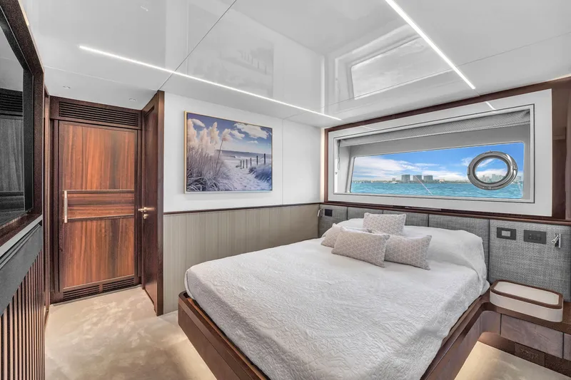 Worth The Wait Yacht Photos Pics Luxurious bedroom interior of 2024 Sunseeker Ocean 182 yacht with ocean view window.