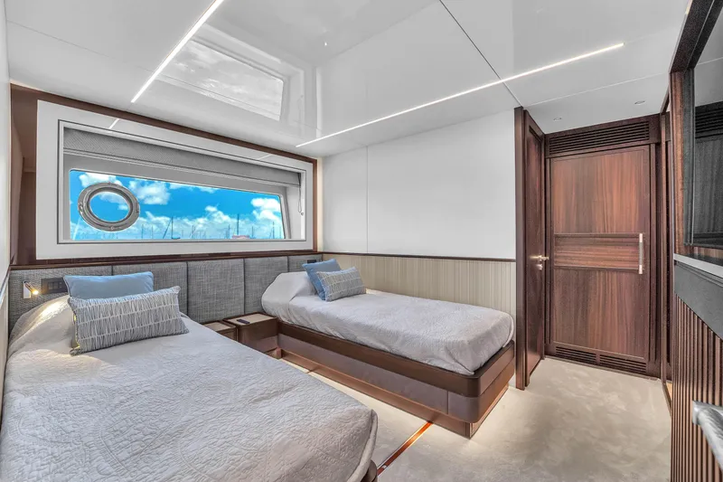 Worth The Wait Yacht Photos Pics Luxurious twin cabin interior of 2024 Sunseeker Ocean 182 yacht with ocean view.