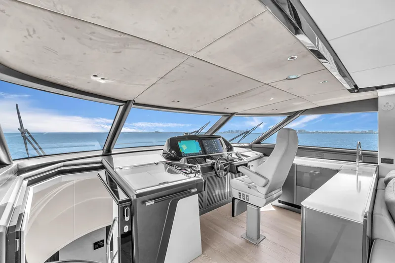 Worth The Wait Yacht Photos Pics Luxurious helm of 2024 Sunseeker Ocean 182 yacht with panoramic ocean views.