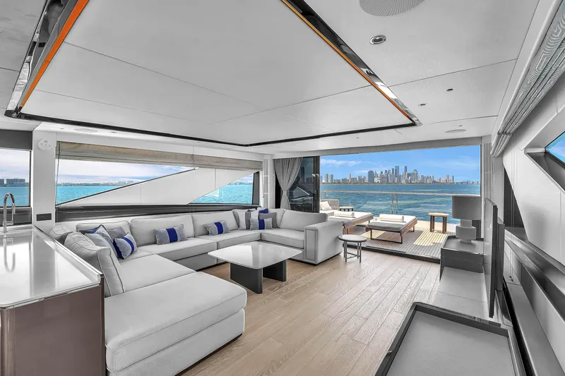 Worth The Wait Yacht Photos Pics Luxurious interior of 2024 Sunseeker Ocean 182 yacht with city skyline view.