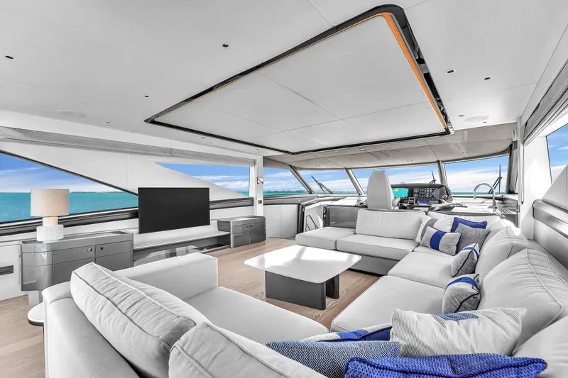 Worth The Wait Yacht Photos Pics Luxurious interior of 2024 Sunseeker Ocean 182 yacht with modern furnishings and ocean view.