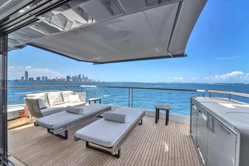 Worth The Wait Yacht Photos Pics Luxurious Sunseeker Ocean 182 yacht deck with city skyline view, 2024 model.
