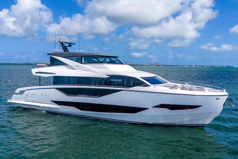 Worth The Wait Yacht Photos Pics 2024 Sunseeker Ocean 182 yacht cruising on open water under a clear blue sky.