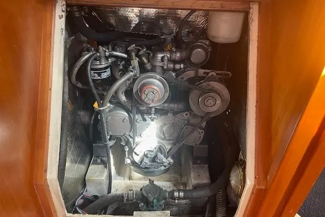 Aquavit Yacht Photos Pics Engine compartment of a 2001 Tartan 3700 sailboat, showcasing mechanical components and wiring.