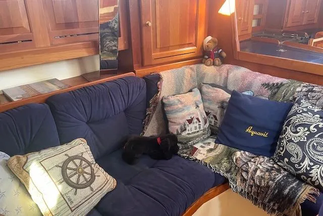 Aquavit Yacht Photos Pics Cozy Tartan 3700 yacht interior with plush cushions and nautical decor, 2001 model.