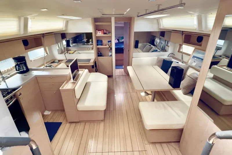  Yacht Photos Pics Interior of 2020 Beneteau Oceanis 51.1 yacht, featuring modern kitchen and dining area.