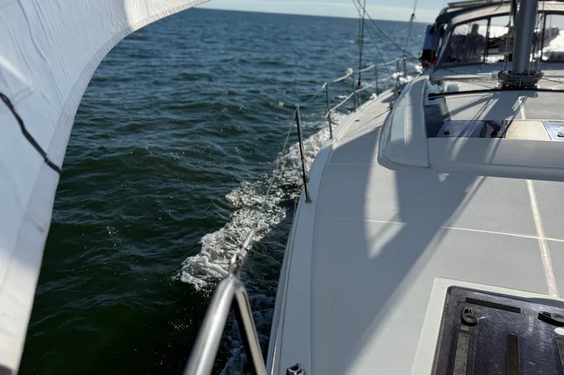  Yacht Photos Pics 2020 Beneteau Oceanis 51.1 sailing on open water, showcasing sleek deck design.