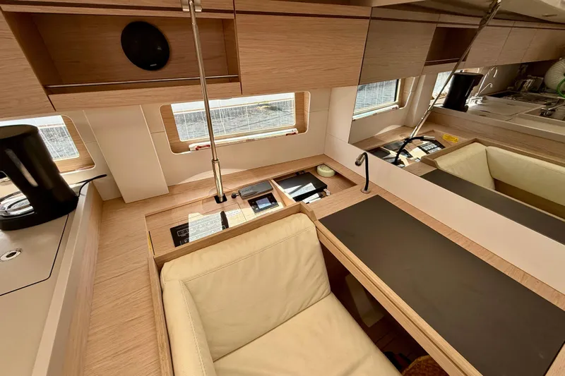  Yacht Photos Pics Luxurious interior of 2020 Beneteau Oceanis 51.1 yacht with modern wood finish.