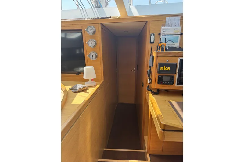  Yacht Photos Pics Interior of 2023 Garcia SLOOP ALUMINIUM 51 yacht with wooden finish and navigation equipment.