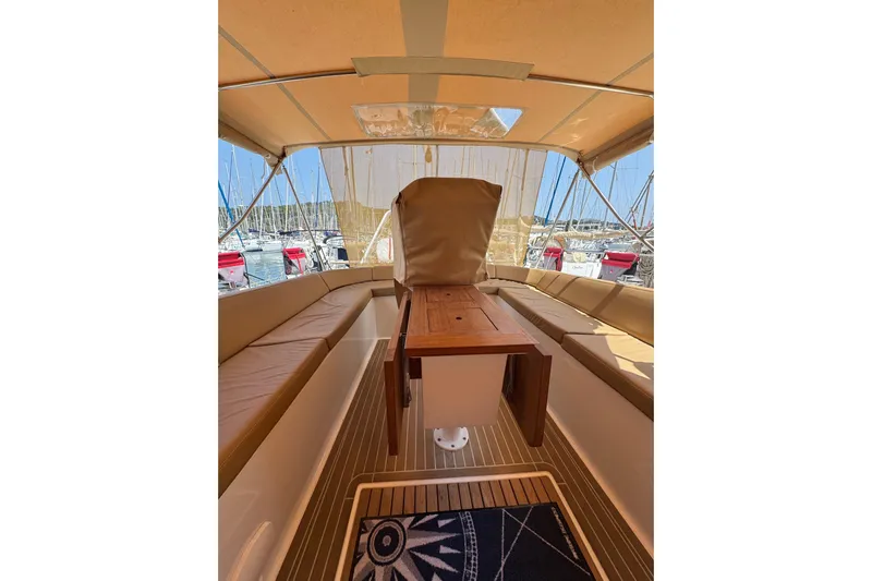 Yacht Photos Pics Interior view of 2023 Garcia SLOOP ALUMINIUM 51 yacht with seating and table.