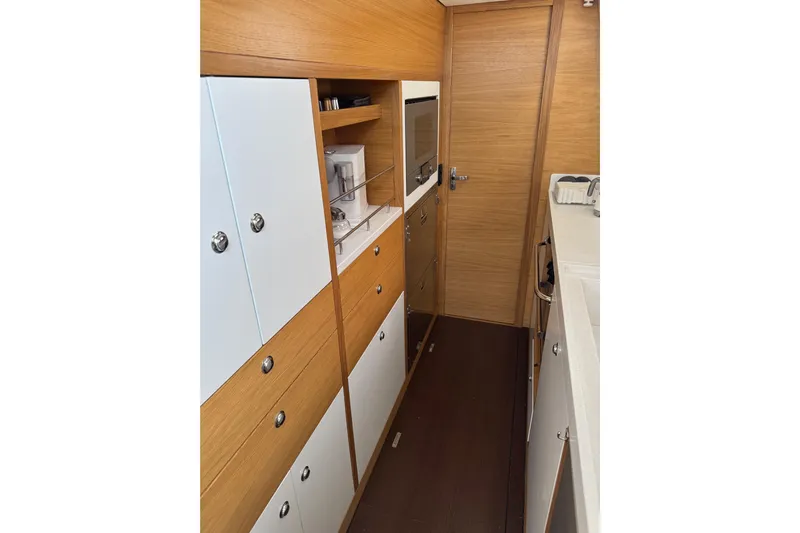  Yacht Photos Pics Interior of 2023 Garcia SLOOP ALUMINIUM 51 yacht, featuring modern wooden cabinetry.