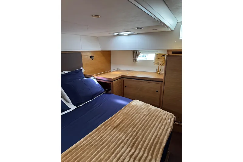  Yacht Photos Pics Luxurious cabin interior of 2023 Garcia Sloop Aluminium 51 yacht with cozy bedding.
