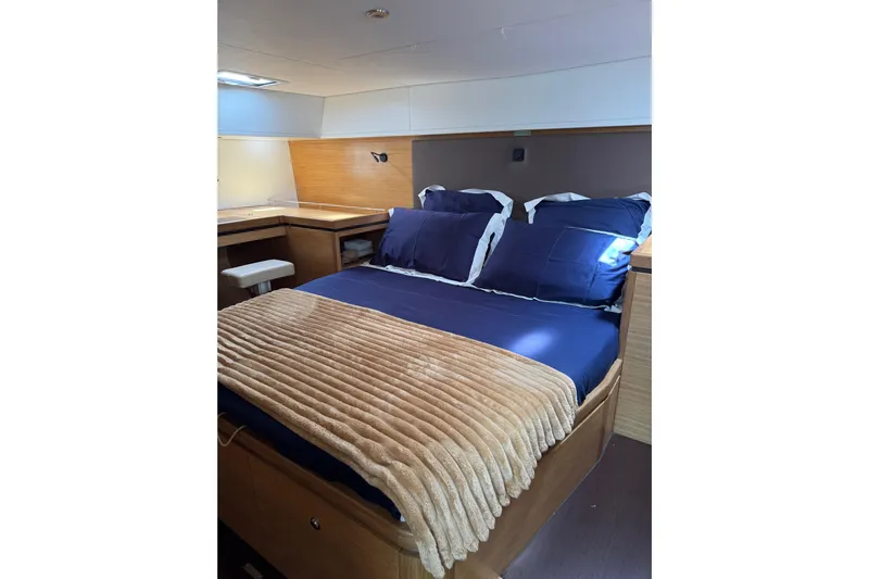  Yacht Photos Pics Luxurious bedroom interior of 2023 Garcia SLOOP ALUMINIUM 51 yacht with cozy bedding.