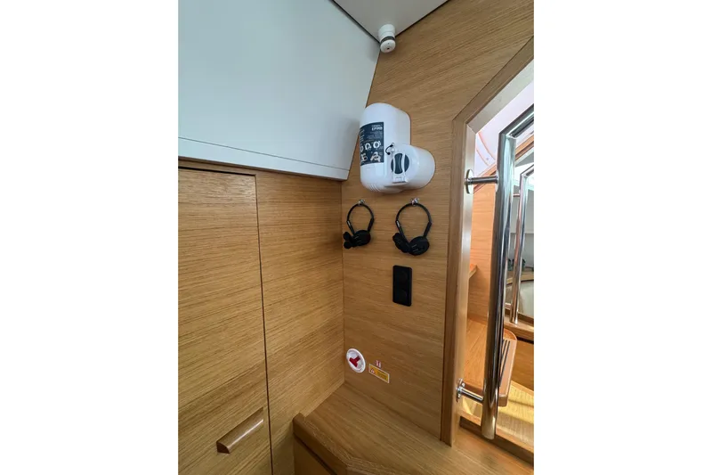  Yacht Photos Pics Interior of 2023 Garcia Sloop Aluminium 51 yacht with wooden paneling and mounted accessories.
