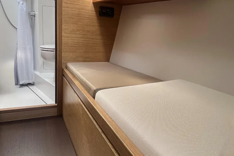  Yacht Photos Pics Interior of 2023 Garcia SLOOP ALUMINIUM 51 yacht, featuring a cozy cabin and bathroom.