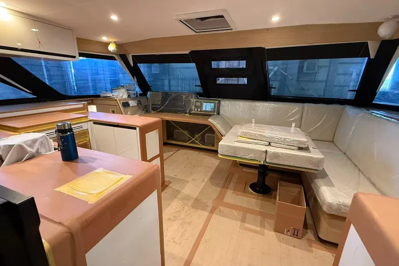  Yacht Photos Pics Luxurious interior of 2026 HH Catamarans HH44 SC with modern seating and navigation area.