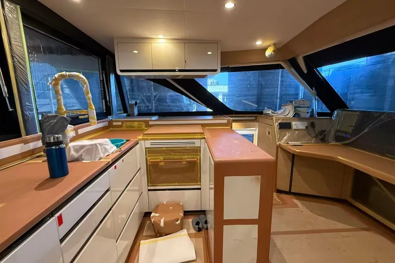  Yacht Photos Pics Modern kitchen interior of 2026 HH Catamarans HH44 SC with sleek design and ample counter space.