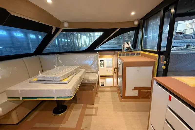  Yacht Photos Pics Interior of 2026 HH Catamarans HH44 SC, featuring modern seating and cabinetry.