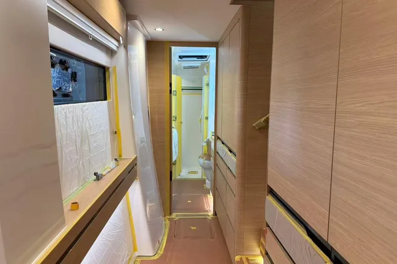  Yacht Photos Pics Interior of 2026 HH Catamarans HH44 SC, featuring modern wood paneling and sleek design.