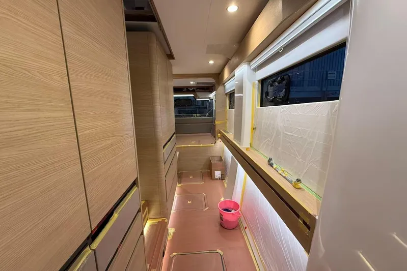  Yacht Photos Pics Modern interior of 2026 HH Catamarans HH44 SC, featuring sleek wood cabinetry and ambient lighting.