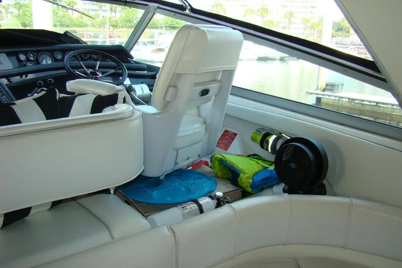 Snri Yacht Photos Pics Interior of 1991 Sea Ray 480 Sundancer yacht with white seating and steering wheel.