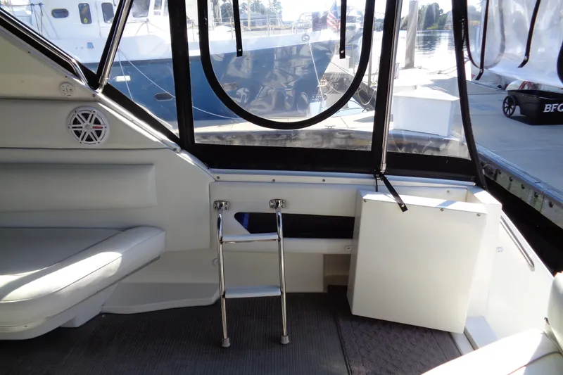 Snri Yacht Photos Pics Interior view of 1991 Sea Ray 480 Sundancer yacht with seating and ladder.