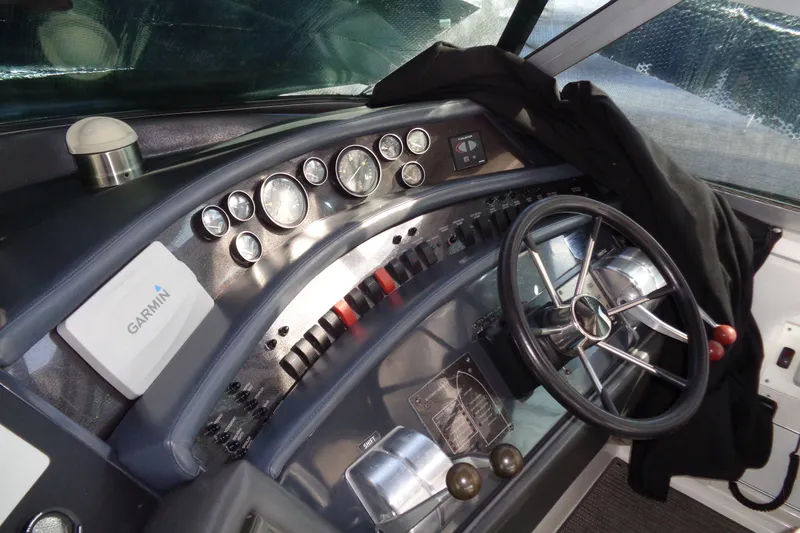 Snri Yacht Photos Pics 1991 Sea Ray 480 Sundancer helm with Garmin navigation and classic gauges.