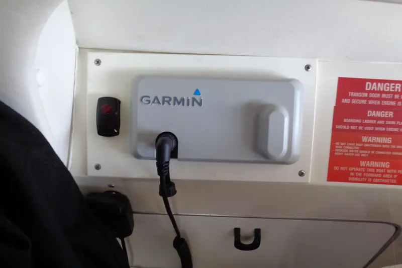 Snri Yacht Photos Pics Garmin device on 1991 Sea Ray 480 Sundancer boat dashboard with safety warnings.