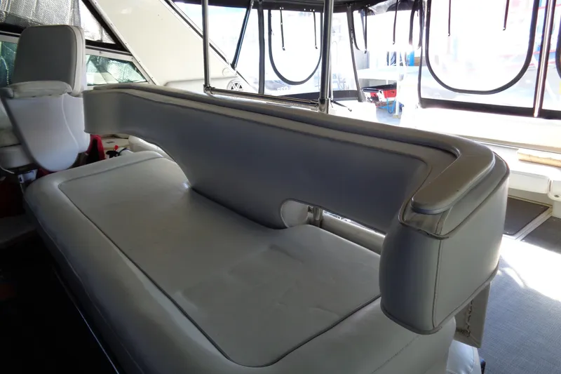 Snri Yacht Photos Pics Interior seating of 1991 Sea Ray 480 Sundancer yacht, featuring white leather upholstery.