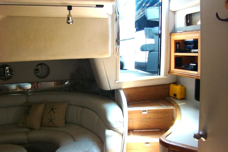 Snri Yacht Photos Pics Interior of 1991 Sea Ray 480 Sundancer yacht with cozy seating and wooden cabinetry.