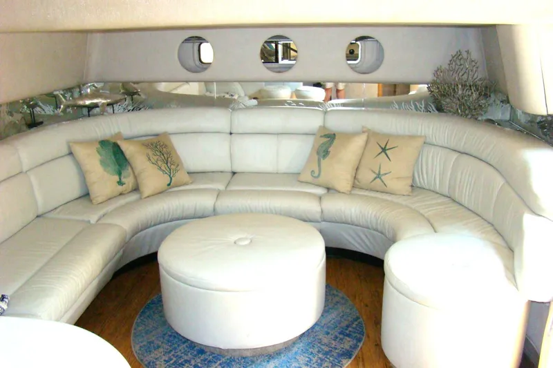 Snri Yacht Photos Pics Luxurious 1991 Sea Ray 480 Sundancer interior with white leather seating and nautical-themed pillows.