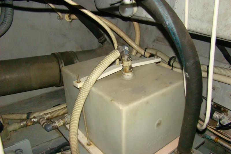 Snri Yacht Photos Pics Engine room of 1991 Sea Ray 480 Sundancer with various hoses and components.