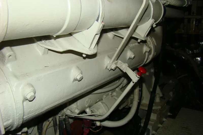 Snri Yacht Photos Pics Engine compartment of 1991 Sea Ray 480 Sundancer boat, featuring mechanical components and piping.