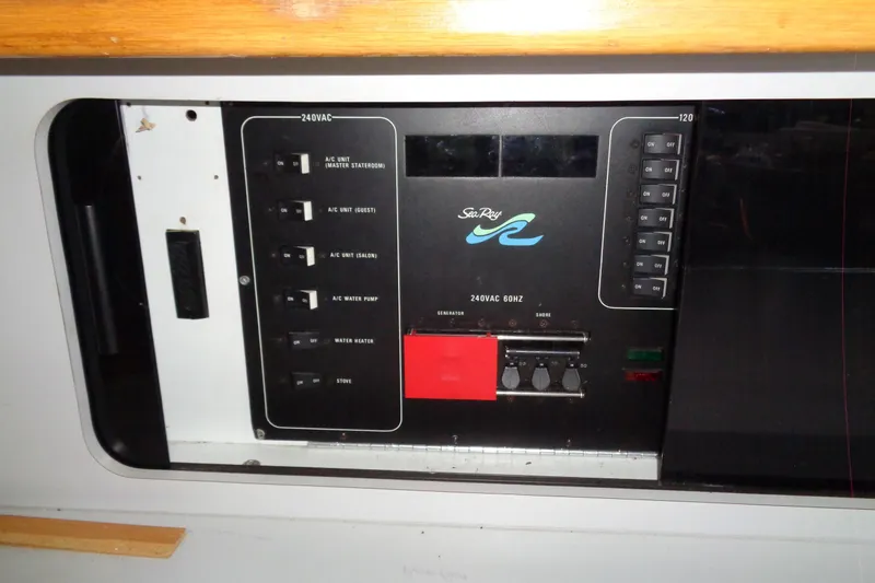 Snri Yacht Photos Pics Electrical control panel of 1991 Sea Ray 480 Sundancer boat, featuring various switches and indicators.