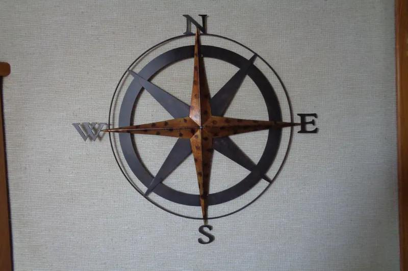 Snri Yacht Photos Pics Wall-mounted compass rose decor on a Sea Ray 480 Sundancer yacht, 1991 model.