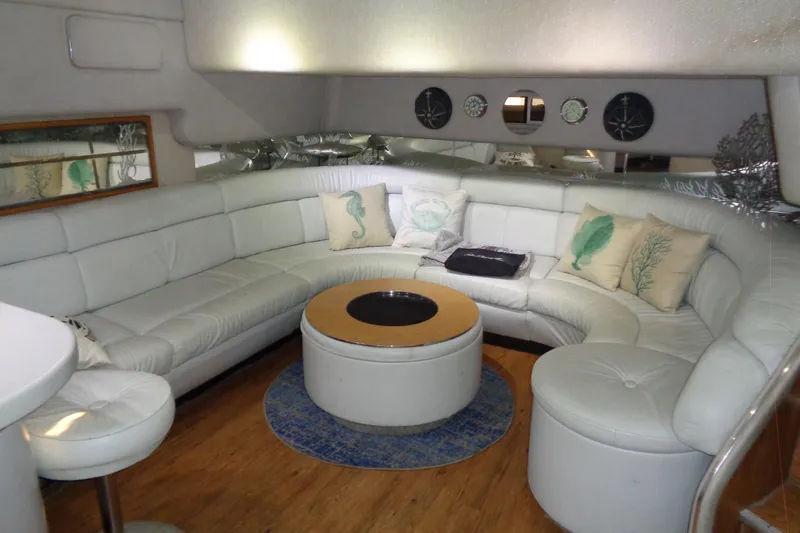 Snri Yacht Photos Pics Luxurious interior of 1991 Sea Ray 480 Sundancer yacht with white leather seating.
