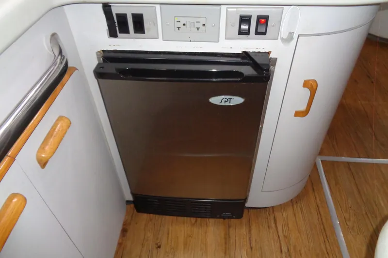 Snri Yacht Photos Pics Compact kitchen area on 1991 Sea Ray 480 Sundancer yacht with SPT mini fridge.