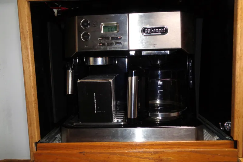 Snri Yacht Photos Pics DeLonghi coffee maker inside a 1991 Sea Ray 480 Sundancer yacht kitchen cabinet.